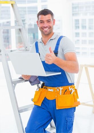 Smiling Handyman giving thumbs up amidst office renovations