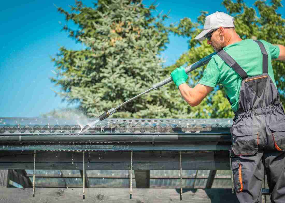 Roof and Gutter cleaning using a high pressure hose wand